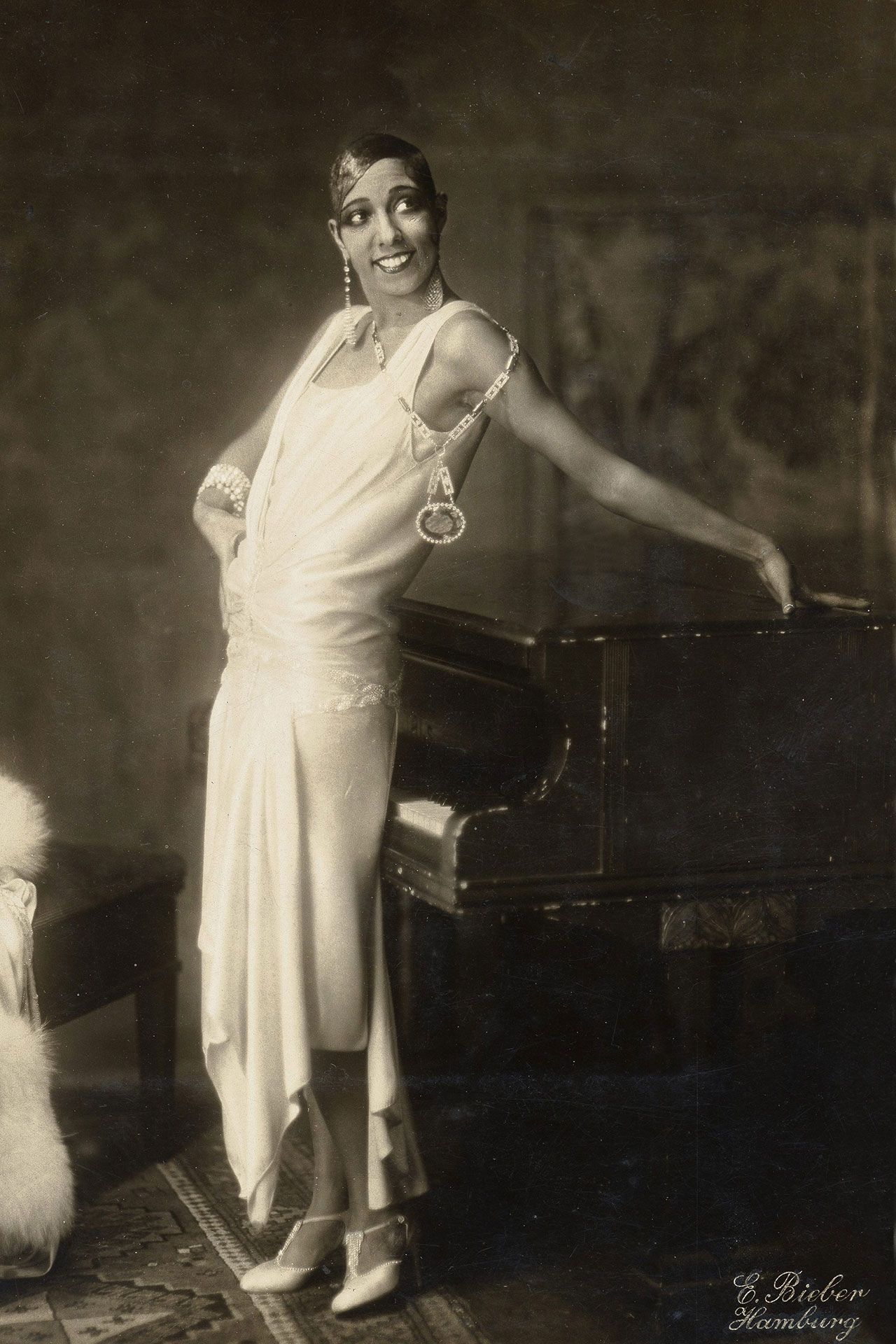 Image may contain Josephine Baker Clothing Dress Adult Person Wedding Footwear High Heel Shoe and Accessories