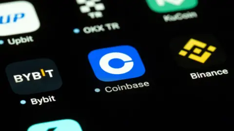Getty Images Coinbase app logo on a phone
