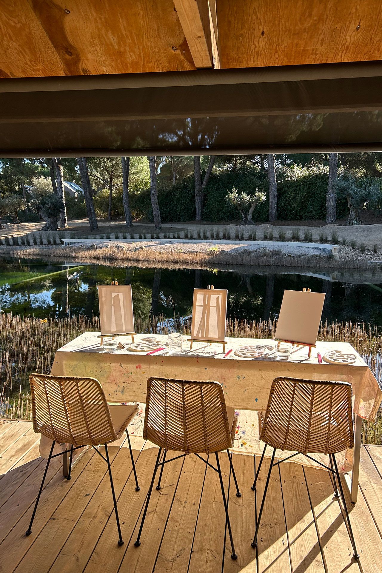 Image may contain Nature Outdoors Scenery Chair Furniture Indoors Interior Design Table Tabletop Wood and Cup