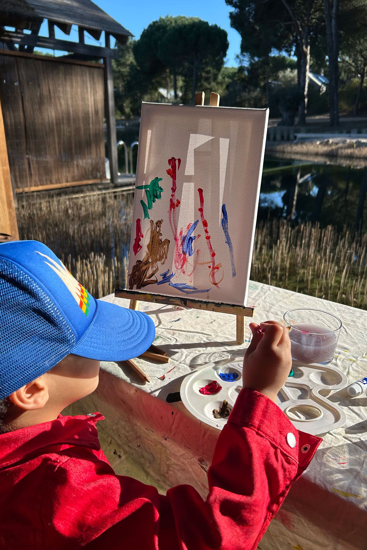 Image may contain Clothing Hat Face Head Person Photography Portrait Cap Baseball Cap Brush Device and Tool