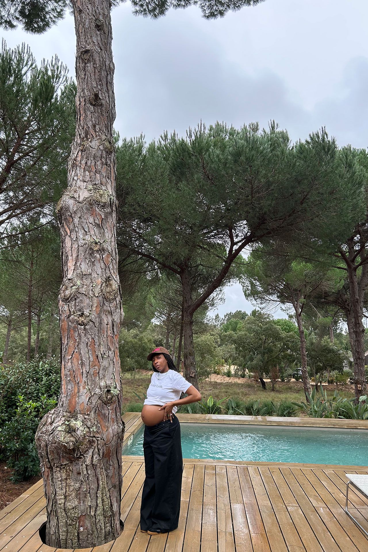 Image may contain Adult Person Clothing Hat Footwear Shoe Chair Furniture and Sitting