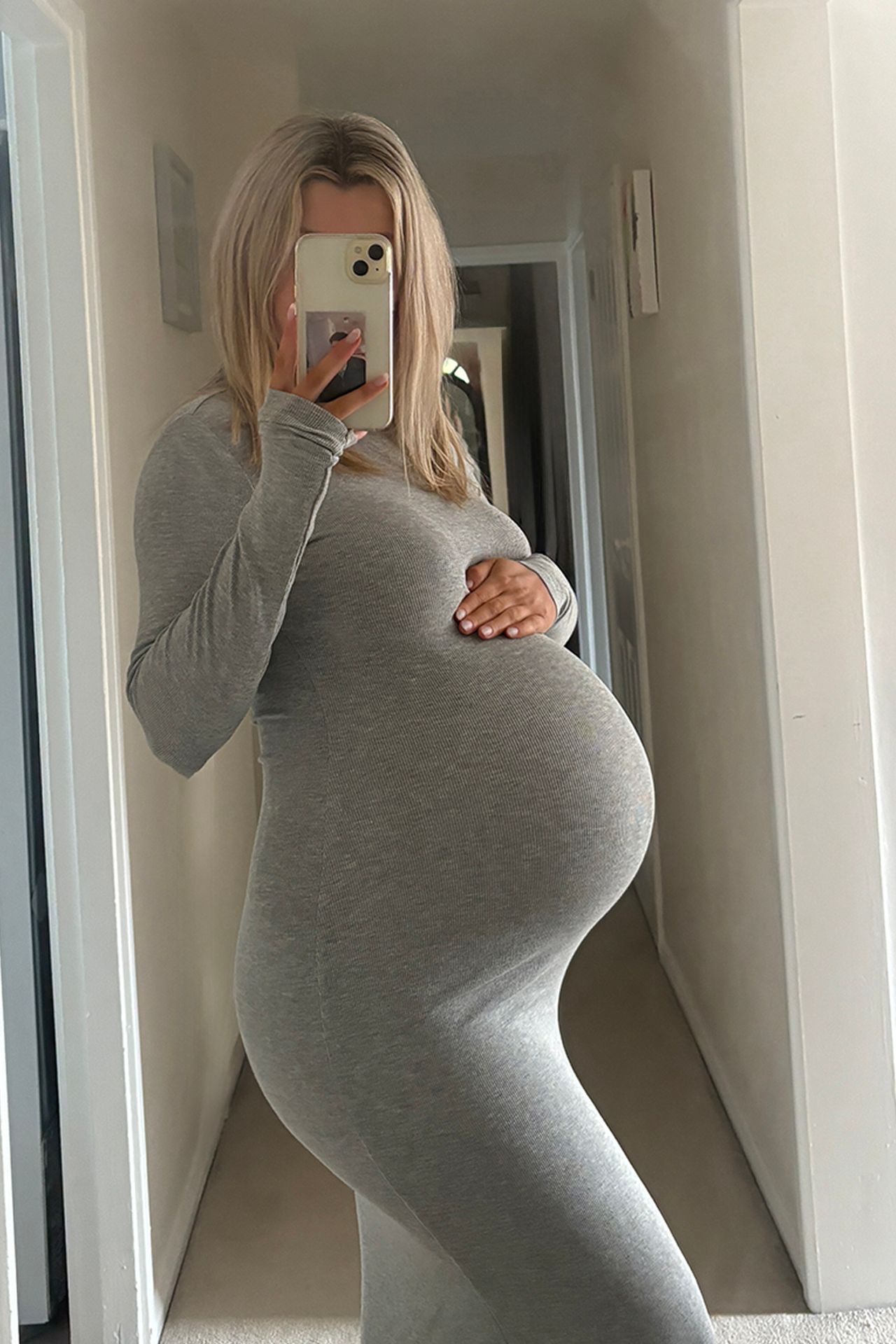 Image may contain Adult Person Clothing Sleeve Electronics Mobile Phone Phone and Head