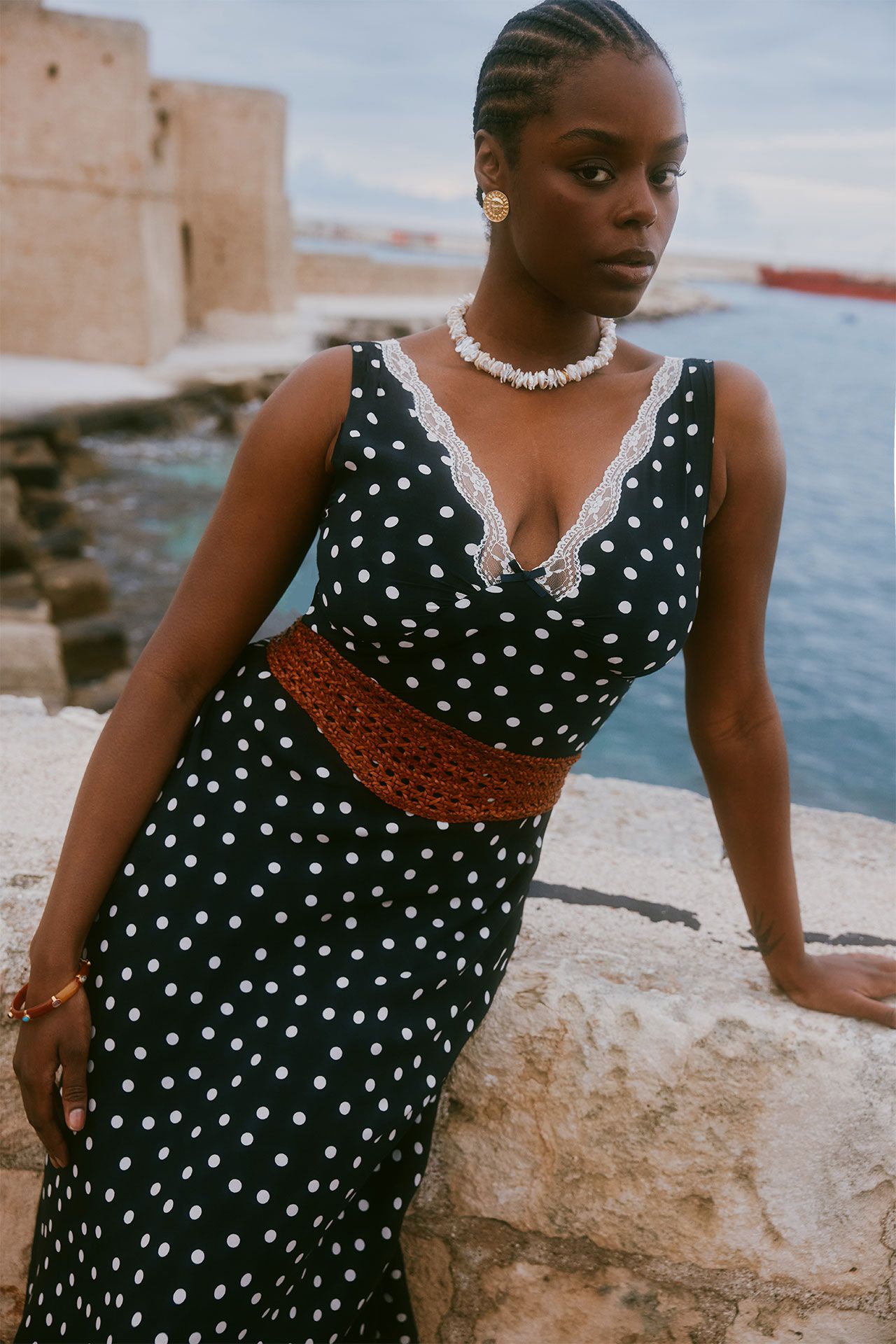 Image may contain Clothing Dress Sleeve Blouse Beachwear Face Head Person Photography Portrait and Accessories