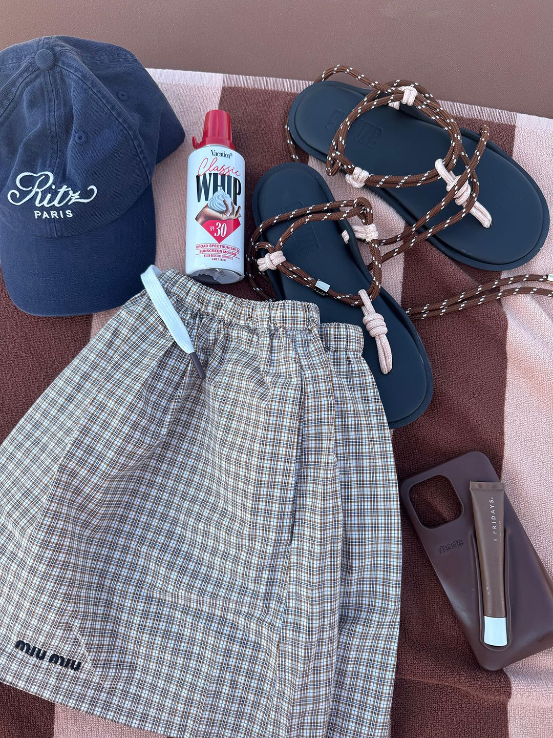 Image may contain Racket Sport Tennis Tennis Racket Clothing Hat Accessories Bag Handbag Blade Knife and Weapon