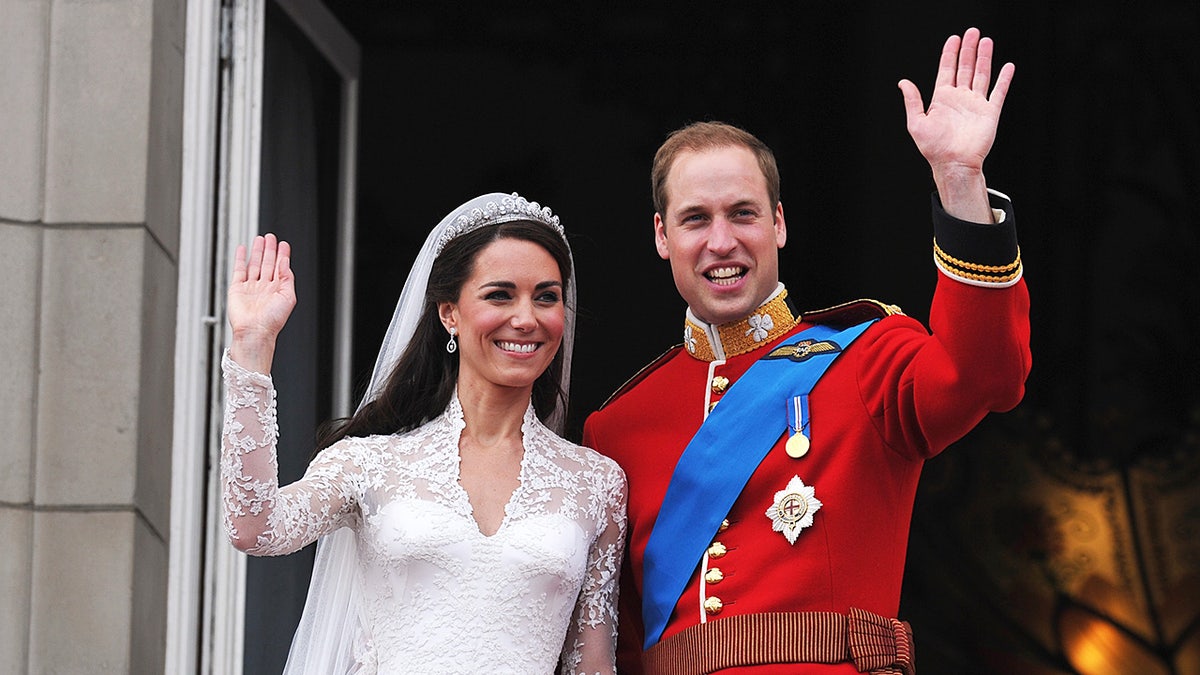 Kate Middleton and Prince William waving on their wedding day.