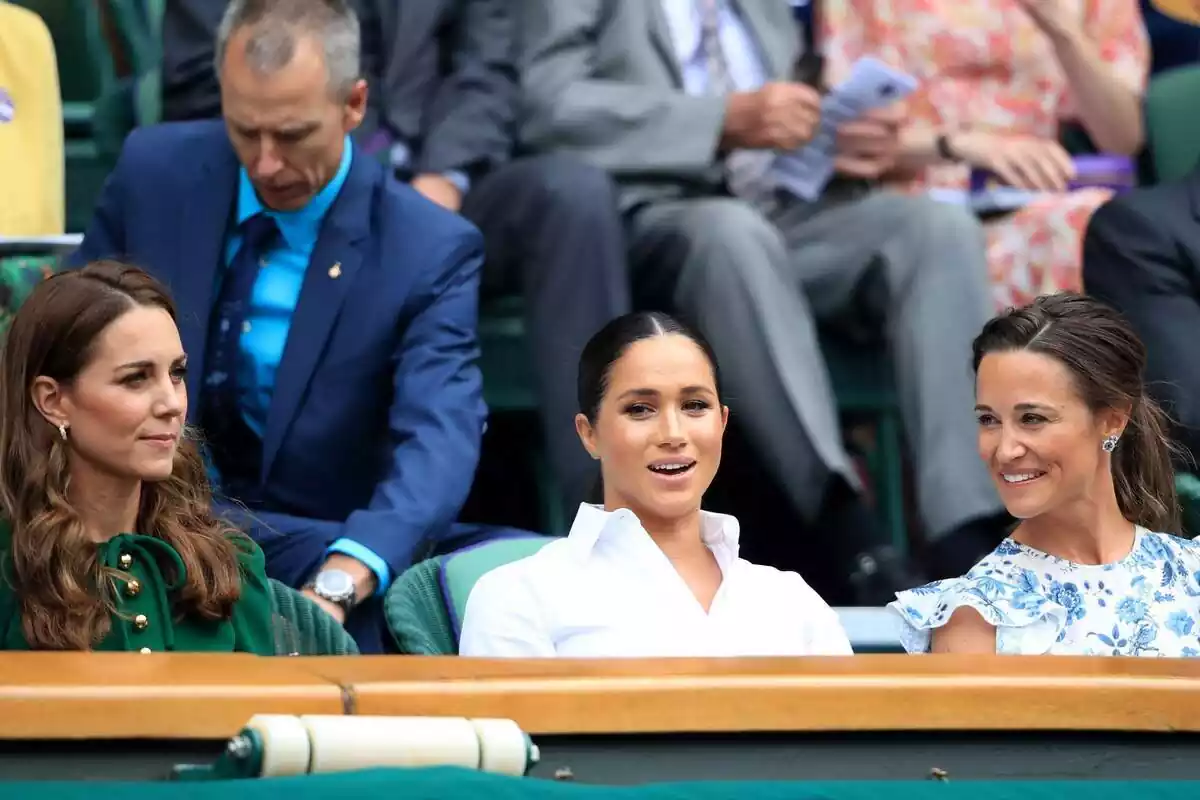 Kate Middleton serious in a green blouse, Meghan Markle talking in a white shirt and Pippa Middleton laughing in a flower blouse