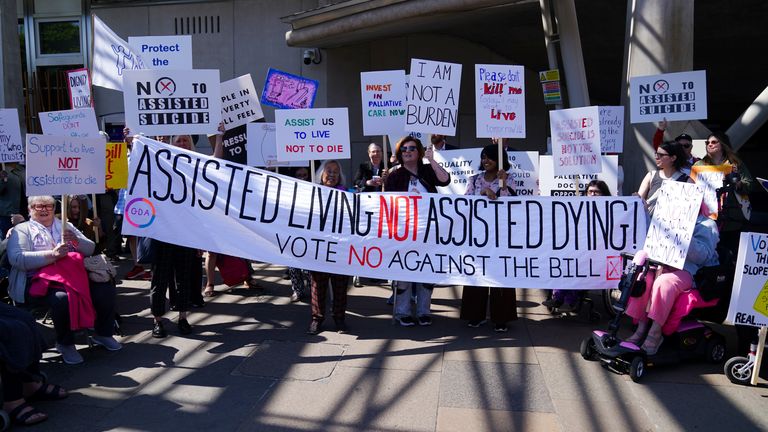 Protesters from the Glasgow Disability Alliance demonstrating outside the Scottish Parliament in Edinburgh, ahead of the debate and vote on the Assisted Dying for Terminally Ill Adults (Scotland) Bill later today. Picture date: Tuesday May 13, 2025.