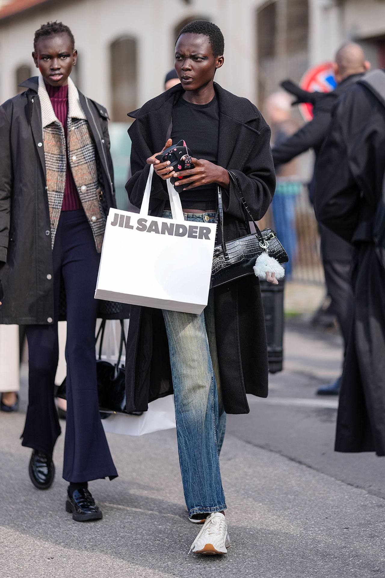 Image may contain Rama Yade Ajuma Nasenyana Accessories Bag Handbag Clothing Pants Pedestrian Person and Adult