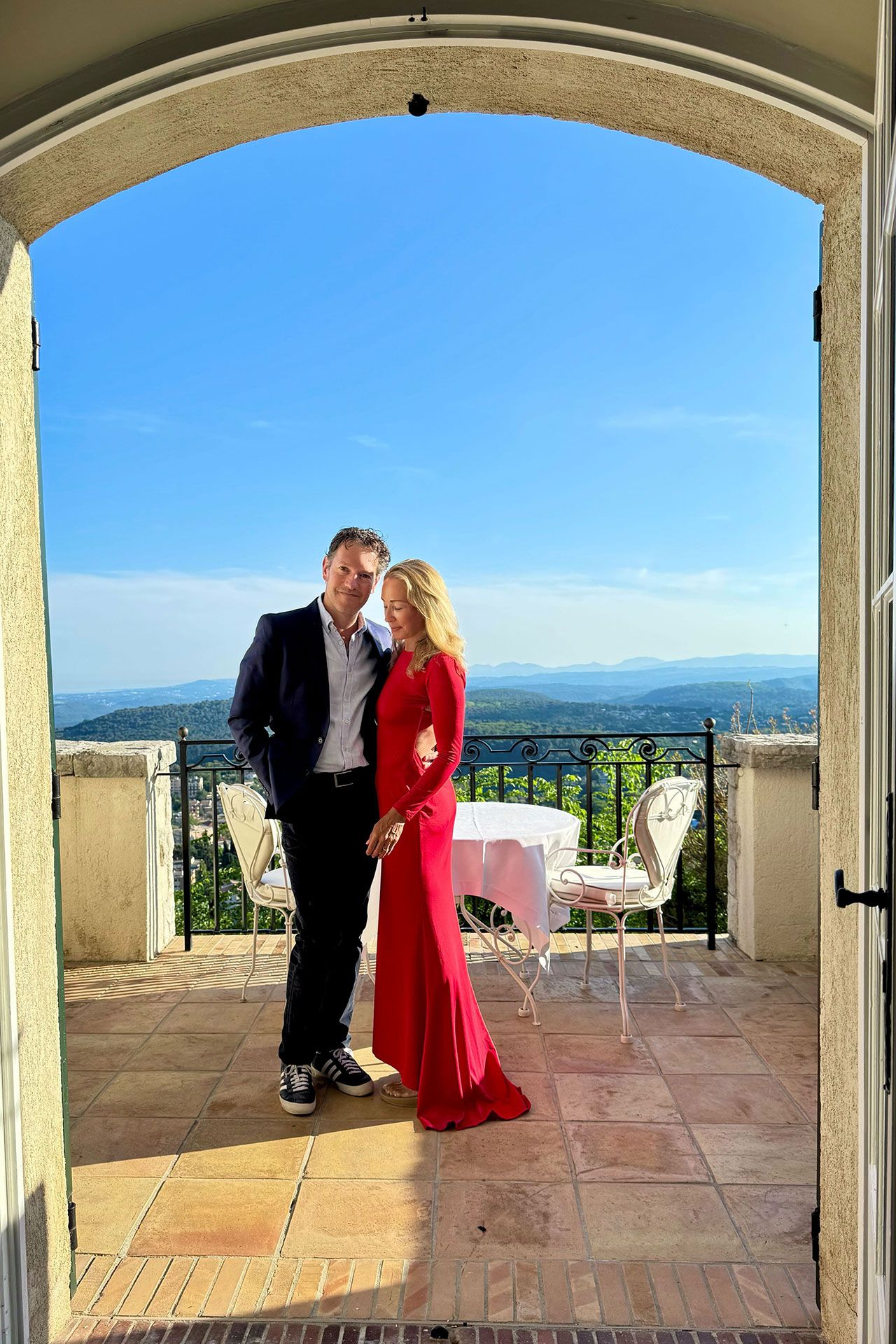 Image may contain Clothing Formal Wear Suit Dress Footwear Shoe Blazer Coat Jacket Chair and Furniture