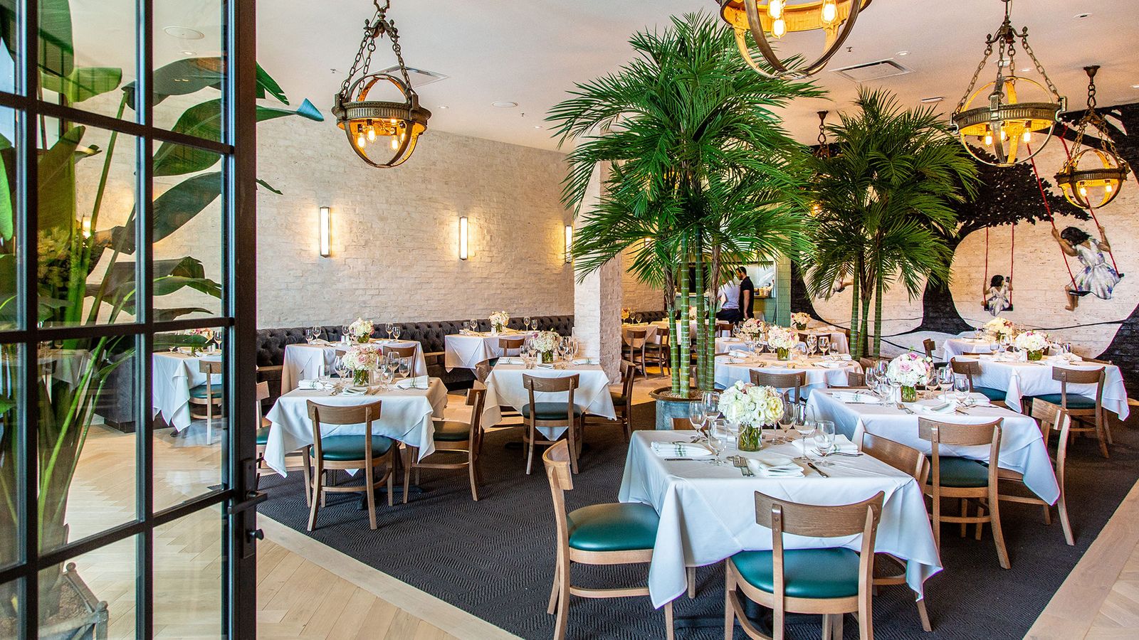 Image may contain Indoors Lamp Architecture Building Dining Room Dining Table Furniture Room Table Fun and Person