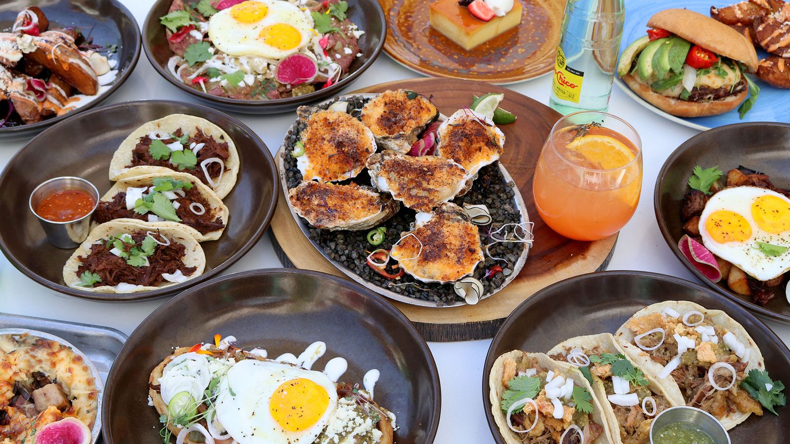 Image may contain Brunch Food Burger Egg Cup Plate Bread Food Presentation and Pizza