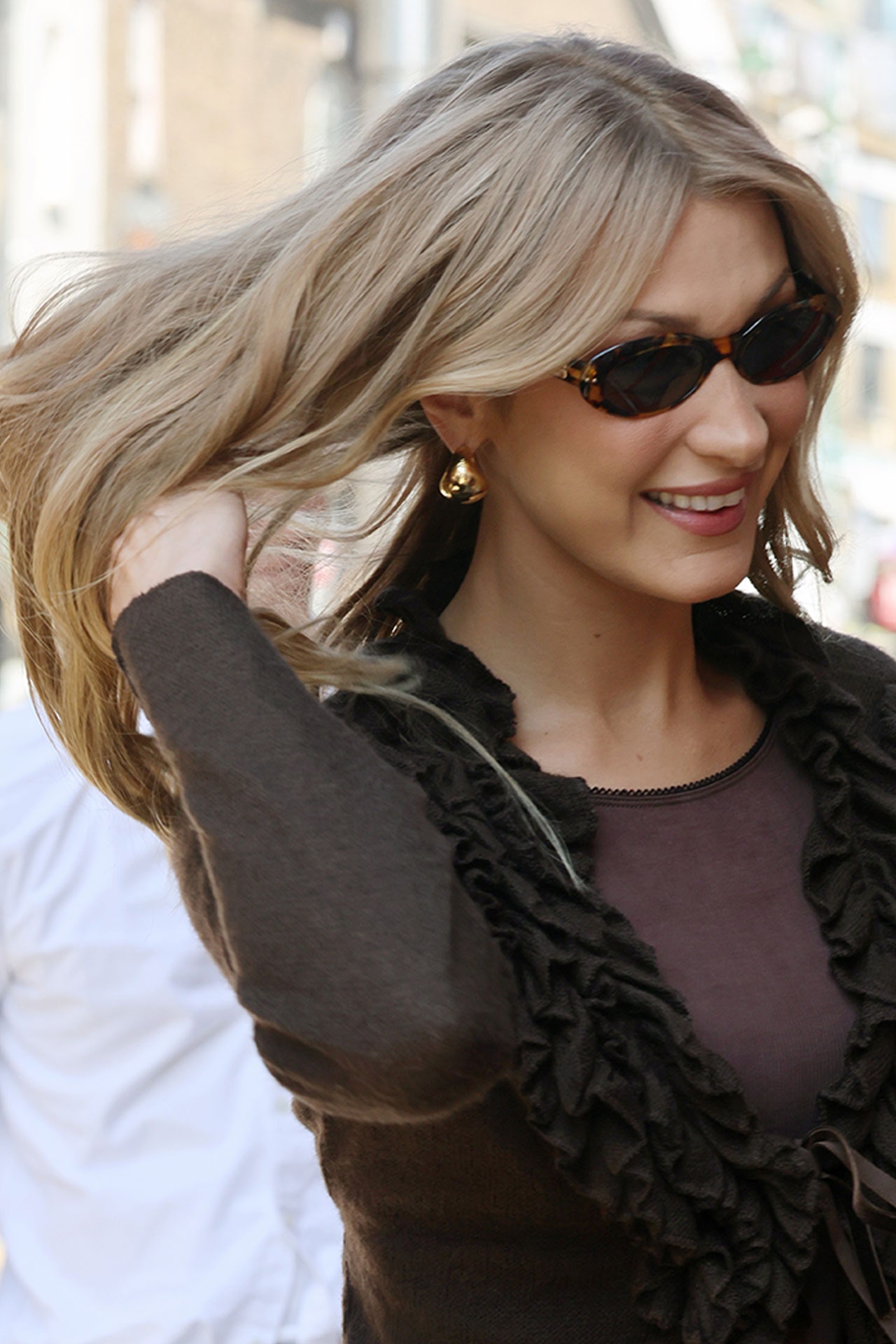 Image may contain Bella Hadid Blonde Hair Person Accessories Glasses Adult Sunglasses Bag and Handbag