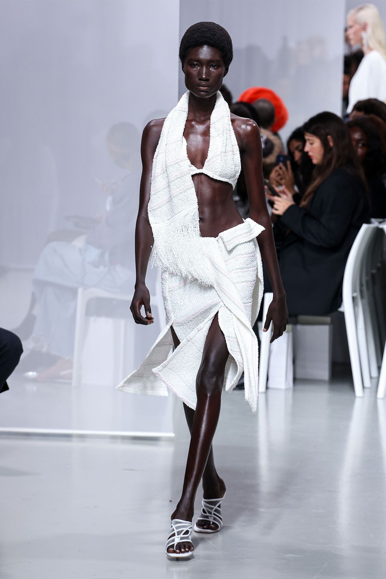 Image may contain Fashion Adult Person Chair Furniture Clothing Footwear High Heel Shoe and Electronics