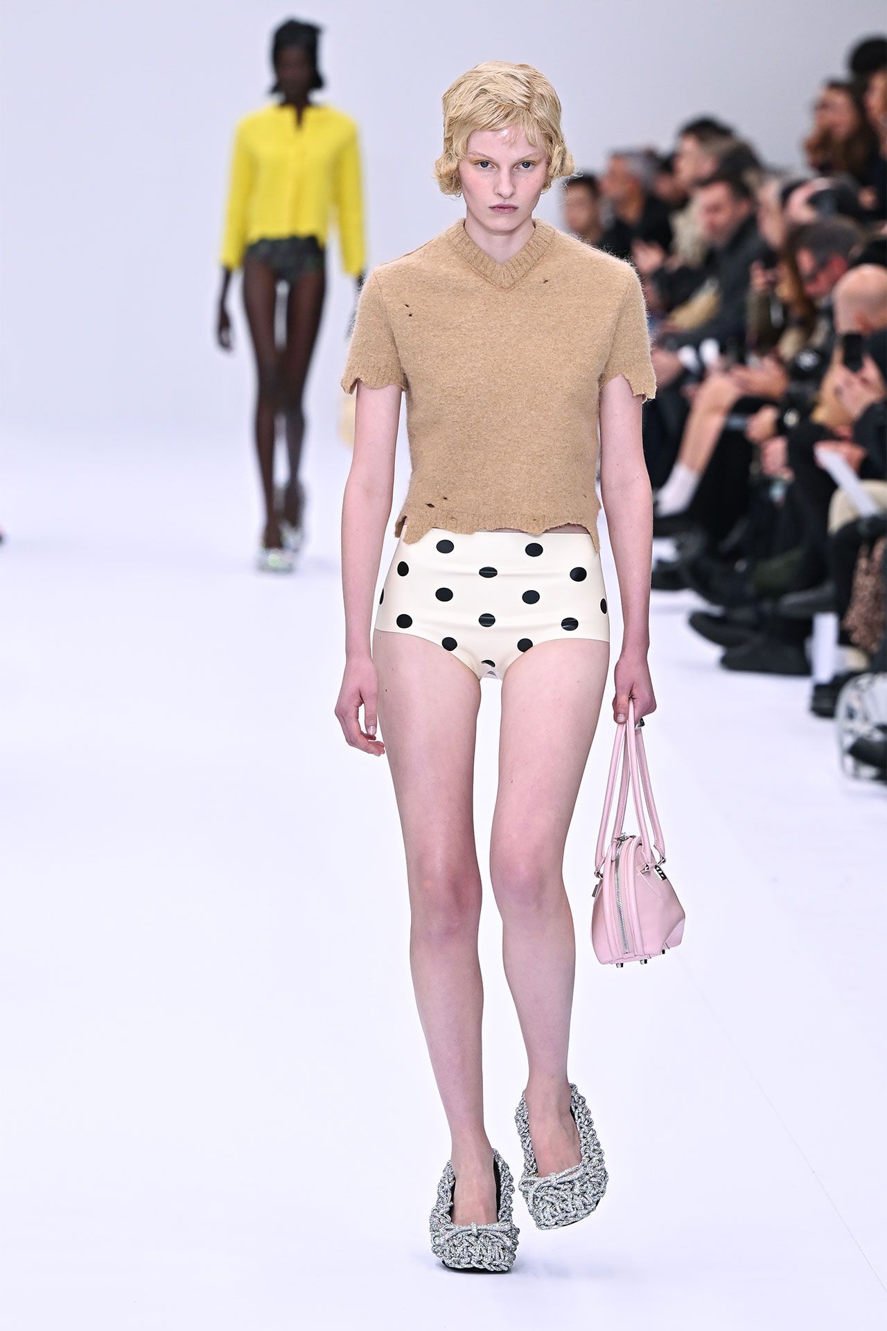 Image may contain Accessories Bag Handbag Adult Person Clothing Footwear Shoe Fashion Shorts and Skirt