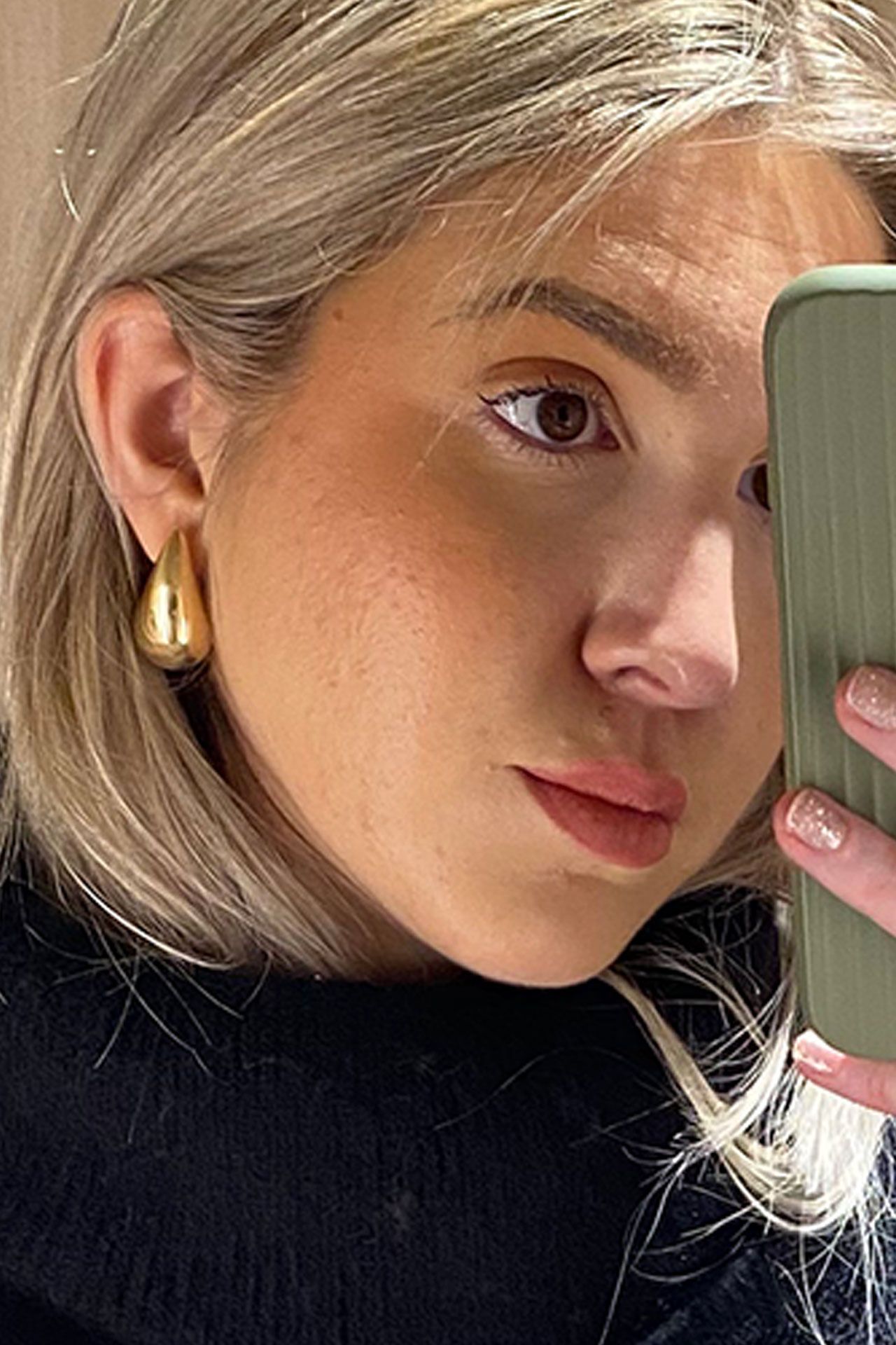 Image may contain Head Person Face Adult Blonde Hair Accessories Earring Jewelry and Skin