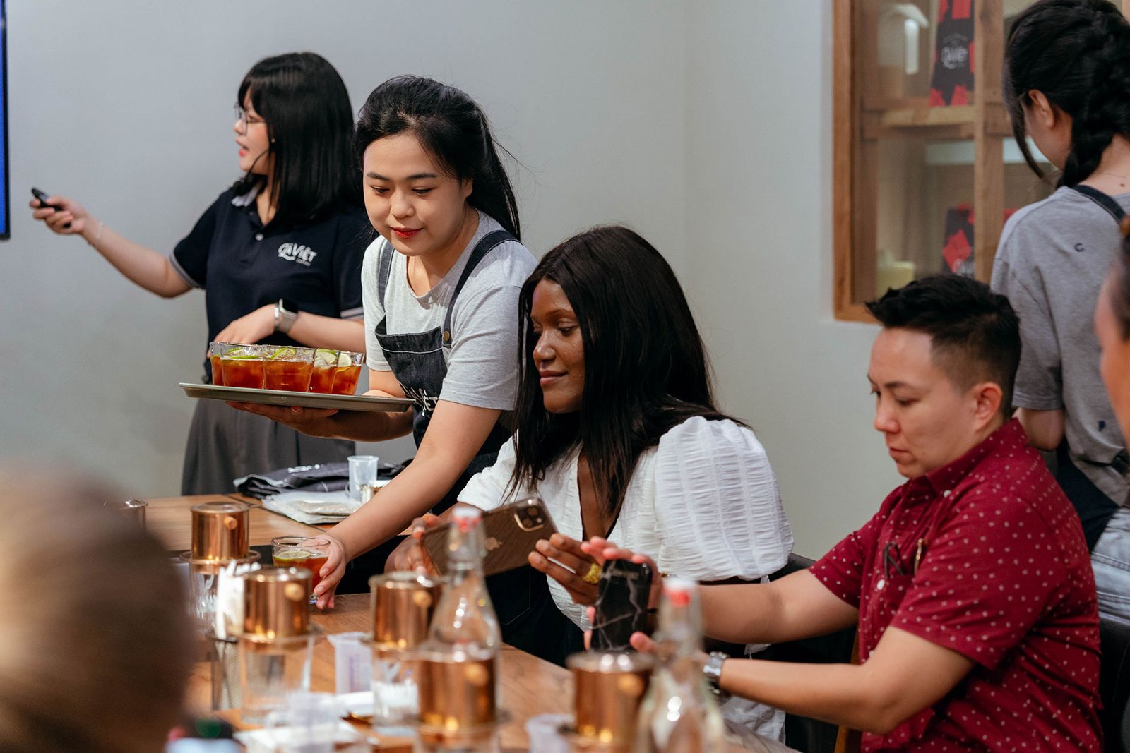 Image may contain Zhai Mo People Person Cup Adult Child Wristwatch Plate Head Face Electronics and Mobile Phone