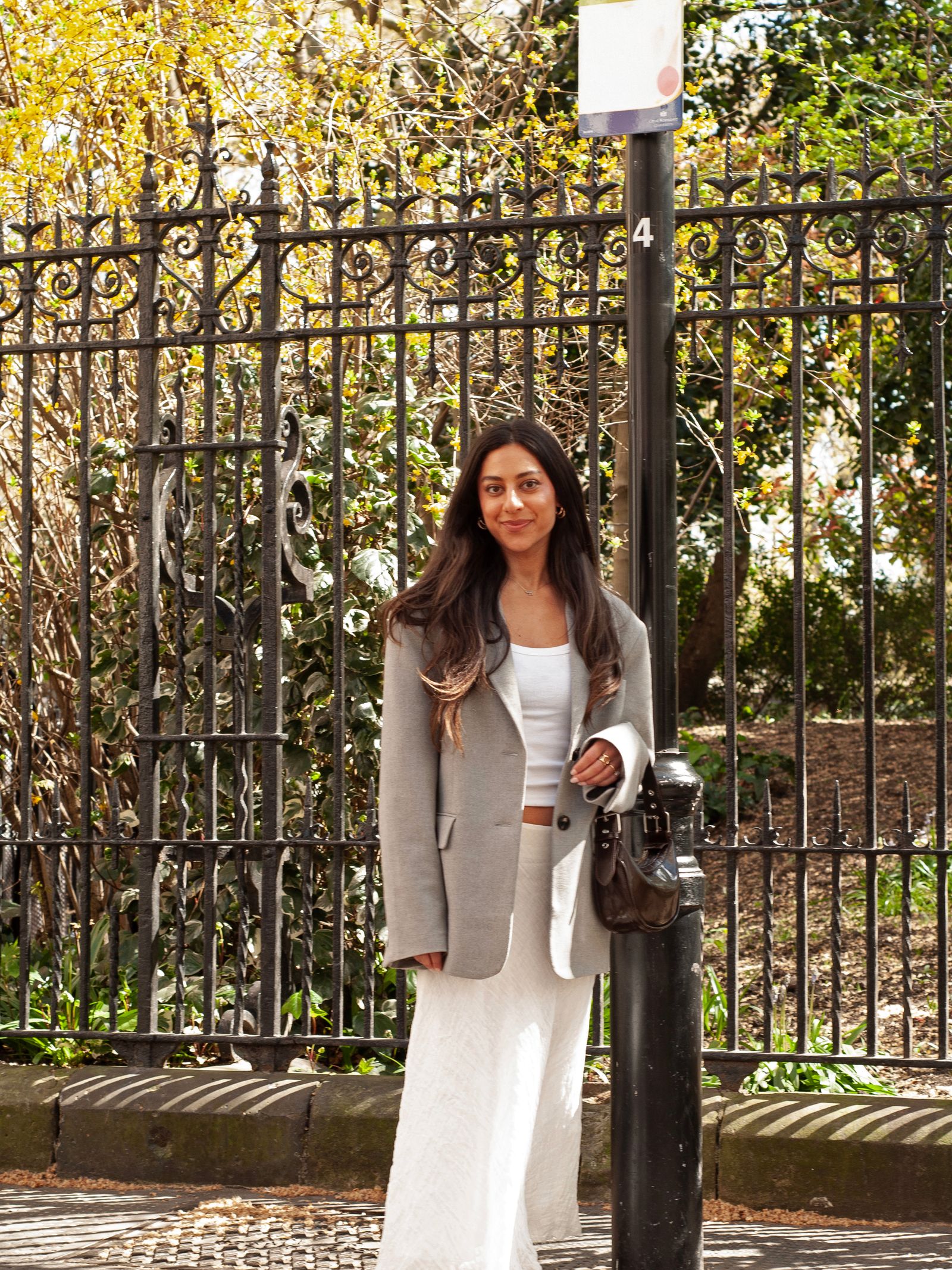 Image may contain Ariel Levy Clothing Dress Formal Wear Photography Adult Person Accessories Bag Handbag and Face