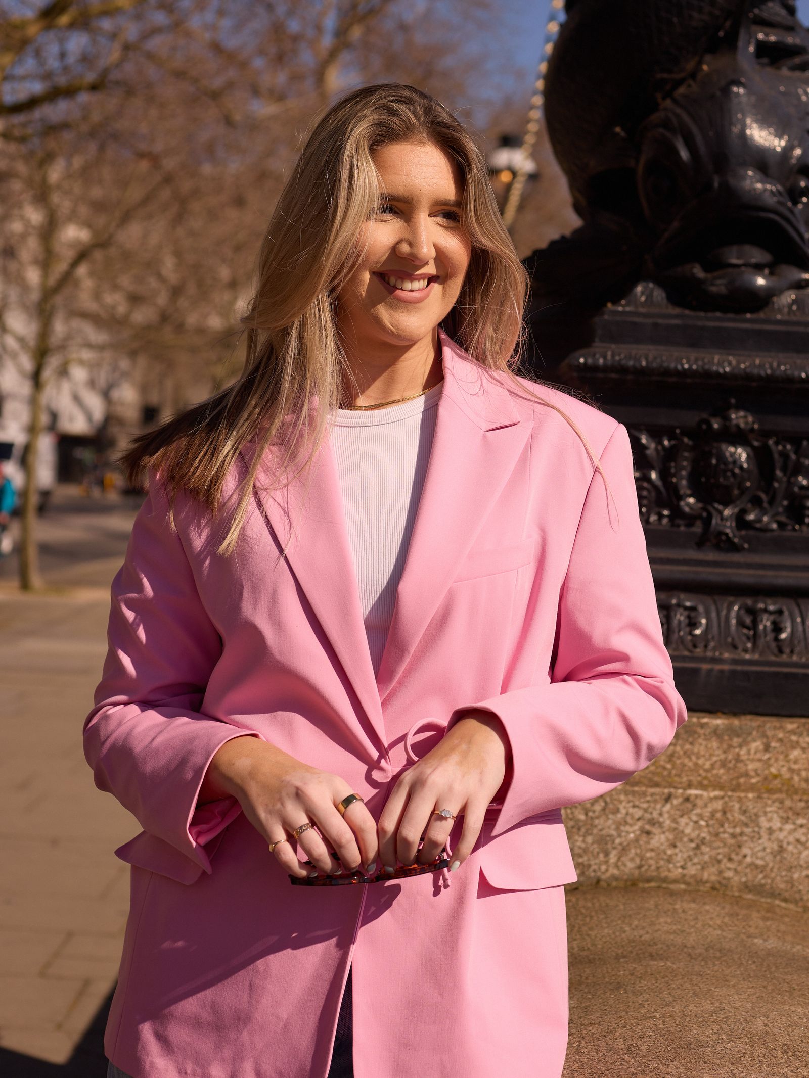 Image may contain Blazer Clothing Coat Jacket Face Head Person Photography Portrait Accessories Jewelry and Ring