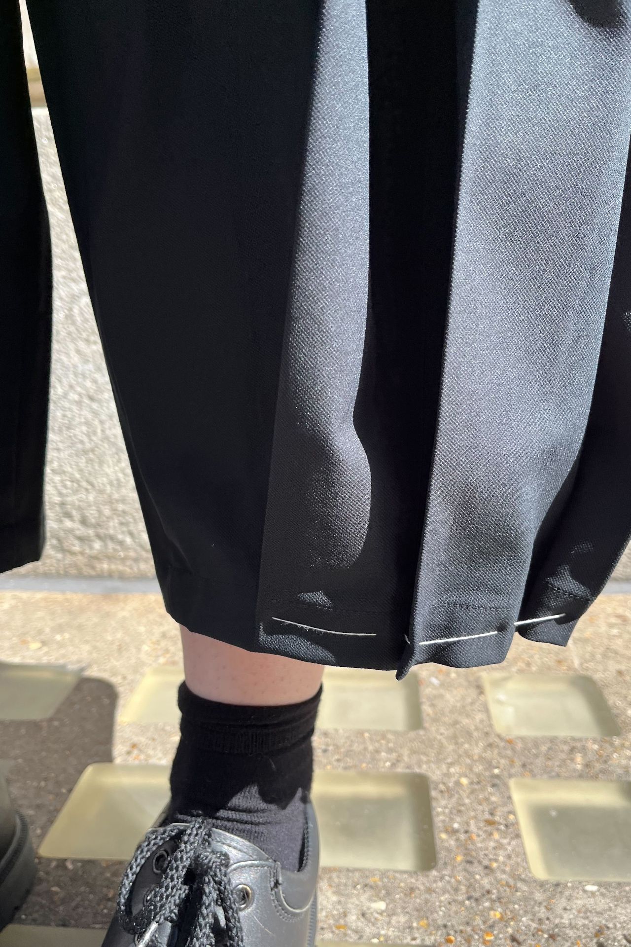 Image may contain Clothing Footwear Shoe Sneaker Person Walking Coat Accessories Bag and Handbag