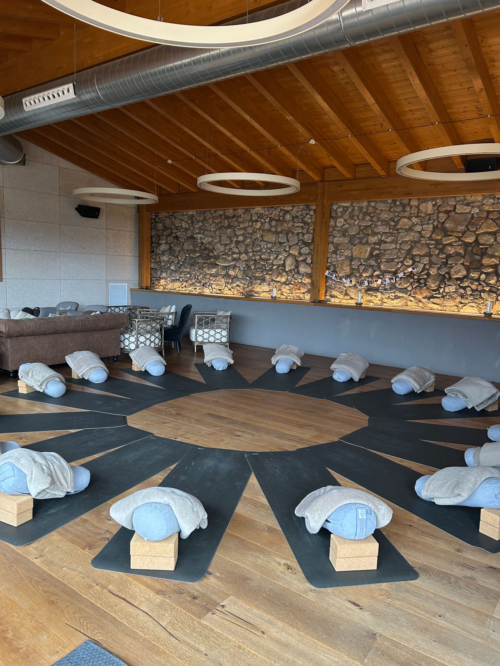 Image may contain Chair Furniture Couch Fitness Pilates Sport Working Out Electronics Speaker Home Decor and Rug