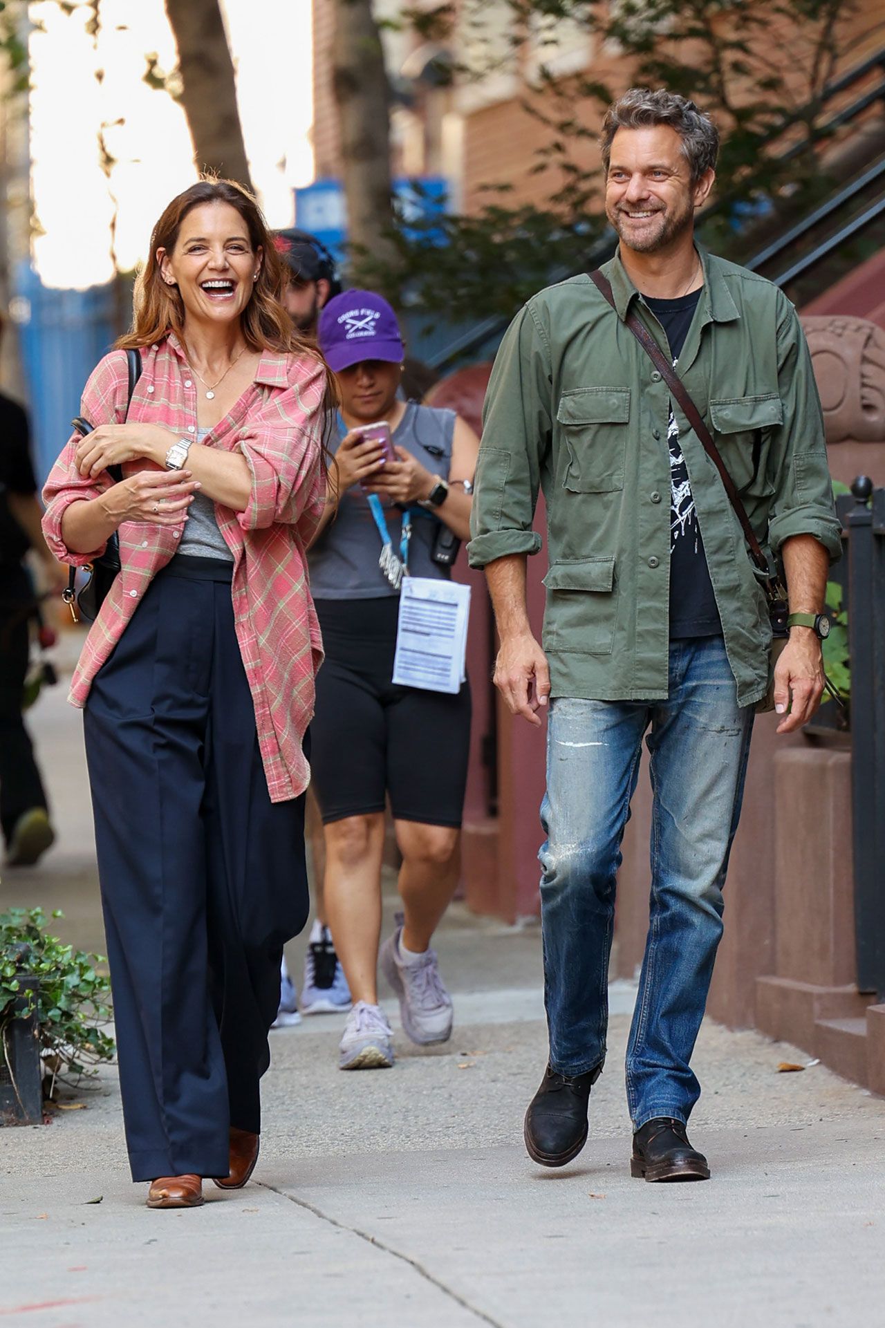 Image may contain Joshua Jackson Katie Holmes Clothing Pants Footwear Shoe Hat Adult Person and Wristwatch