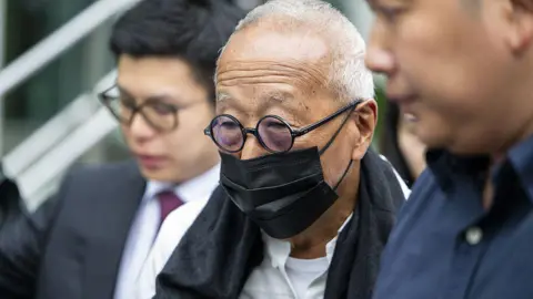 Getty Images Ong Beng Seng wearing a black mask and round spectacles