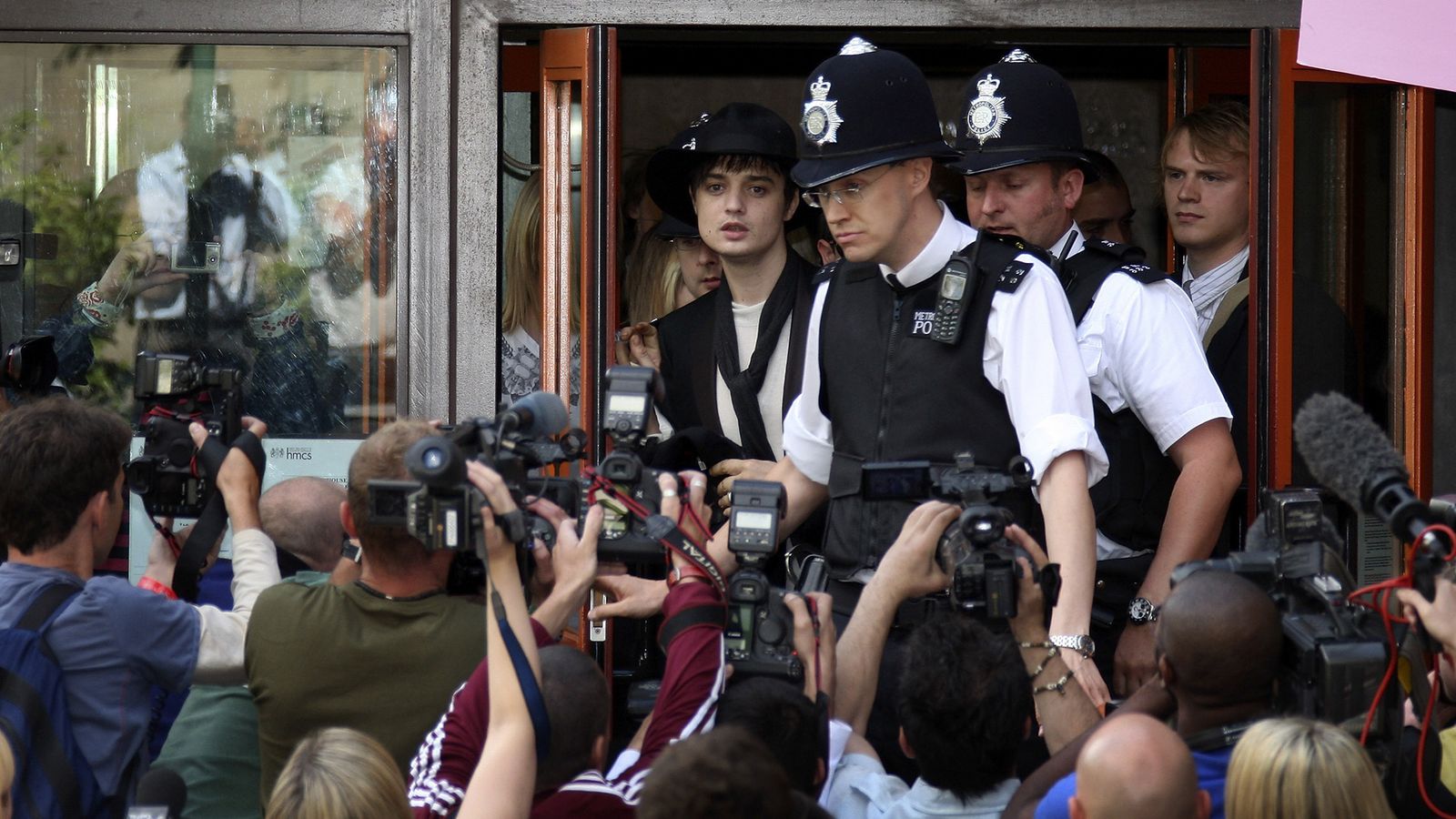 Image may contain Pete Doherty Kari Arkivuo Paparazzi Person Electrical Device Microphone Wristwatch and Helmet