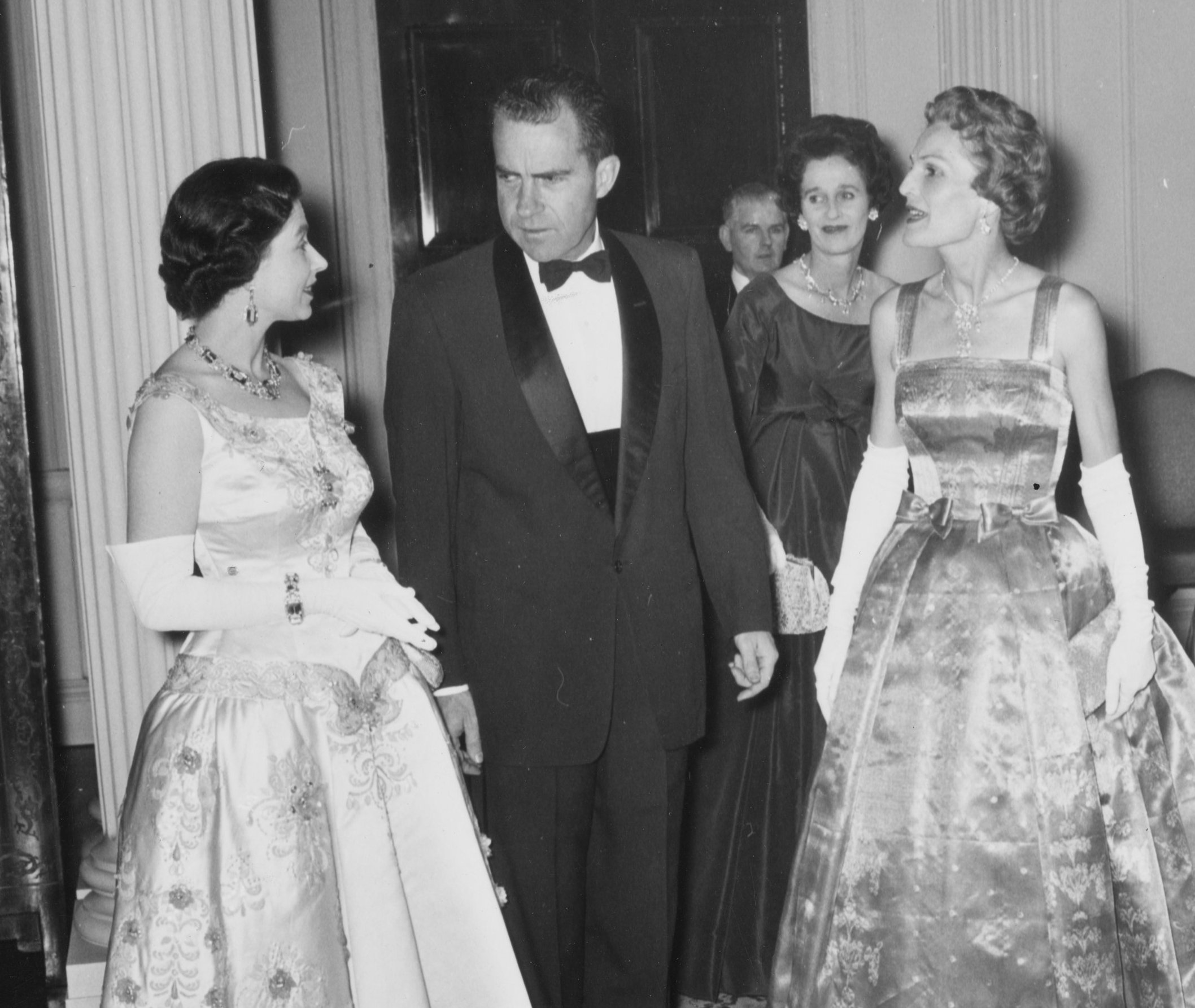 Queen Elizabeth II with Vice President Richard Nixon and others at a dinner.