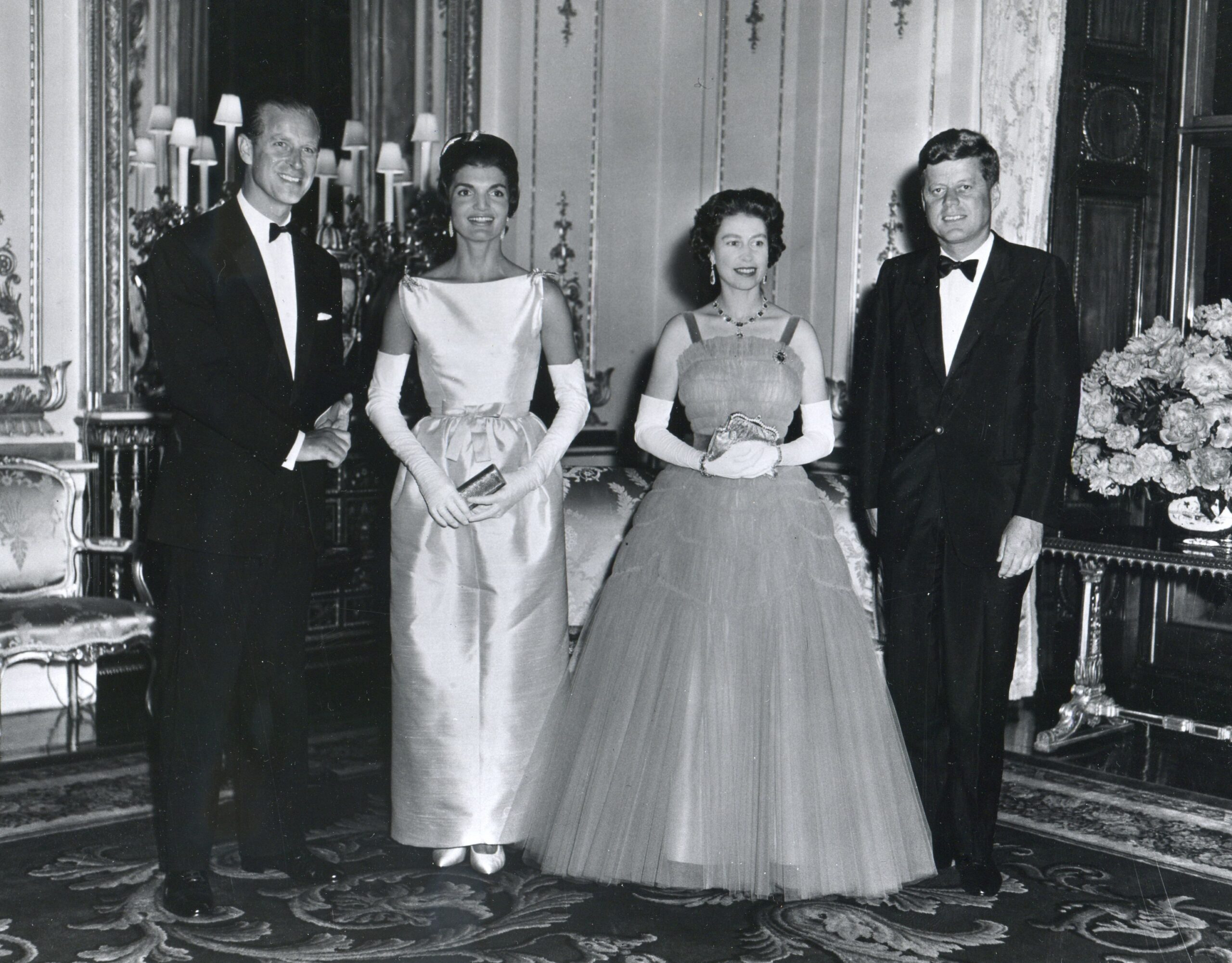Photo of President John F. Kennedy, First Lady Jacqueline Kennedy, Queen Elizabeth II, and Prince Philip at Buckingham Palace.