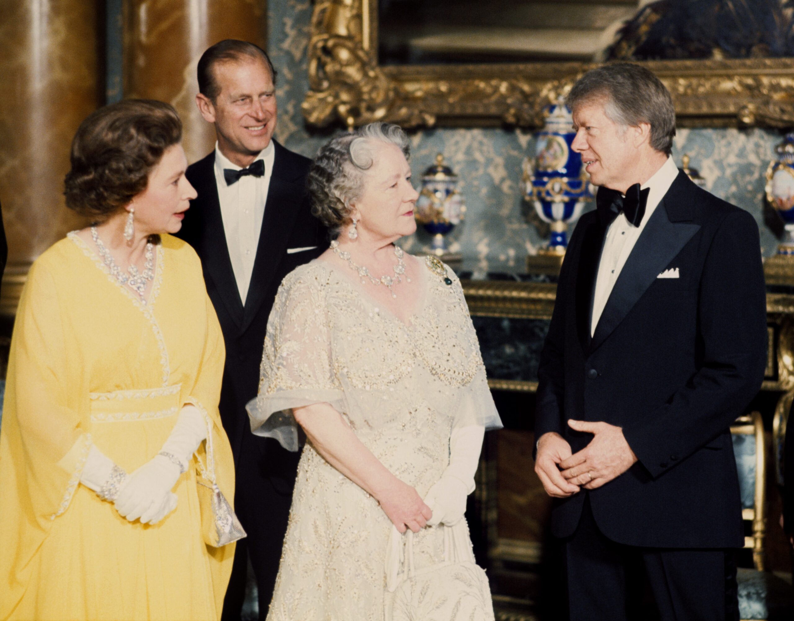 Photo of Queen Elizabeth II, Prince Philip, the Queen Mother, President Jimmy Carter, and Prime Minister Giulio Andreotti at Buckingham Palace.