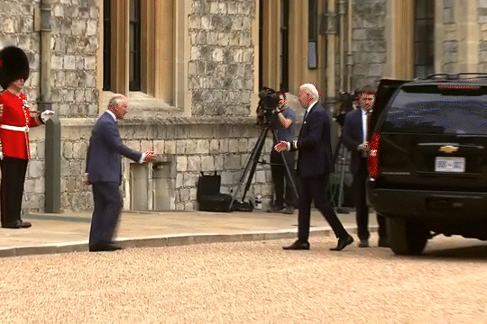 President Biden and King Charles III shaking hands.