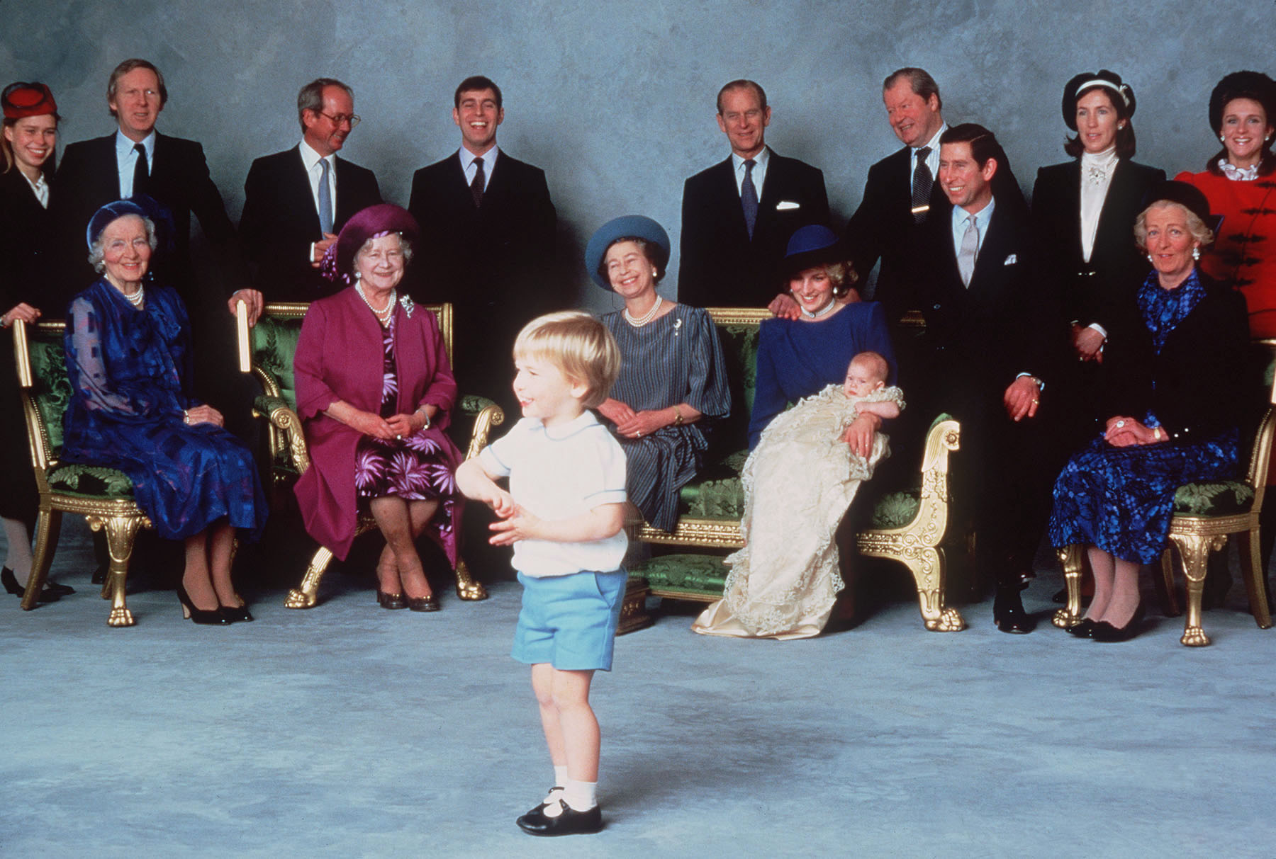 Prince William entertaining a group of royalty posed for pictures at Prince Harry's christening