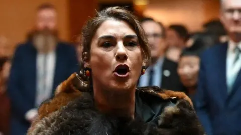 Getty Images King Charles is heckled by Australian politician Senator Lidia Thorpe before she was escorted away by security at the Australian Parliament House for Ceremonial Welcome and Parliamentary Reception, Canberra, Australia on 21 October, 2024.