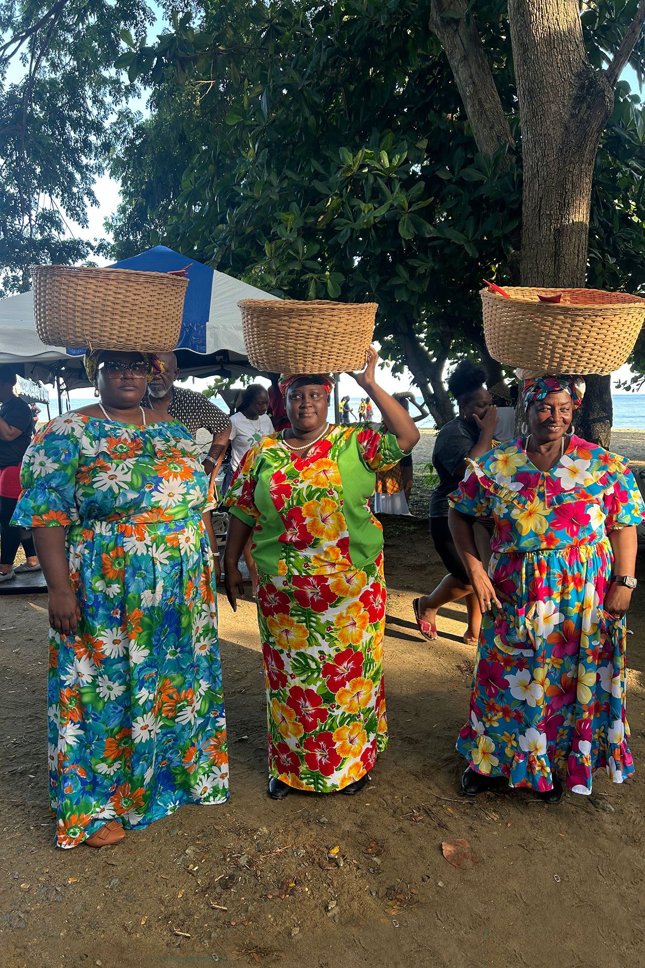 Women in traditional costumes take a break