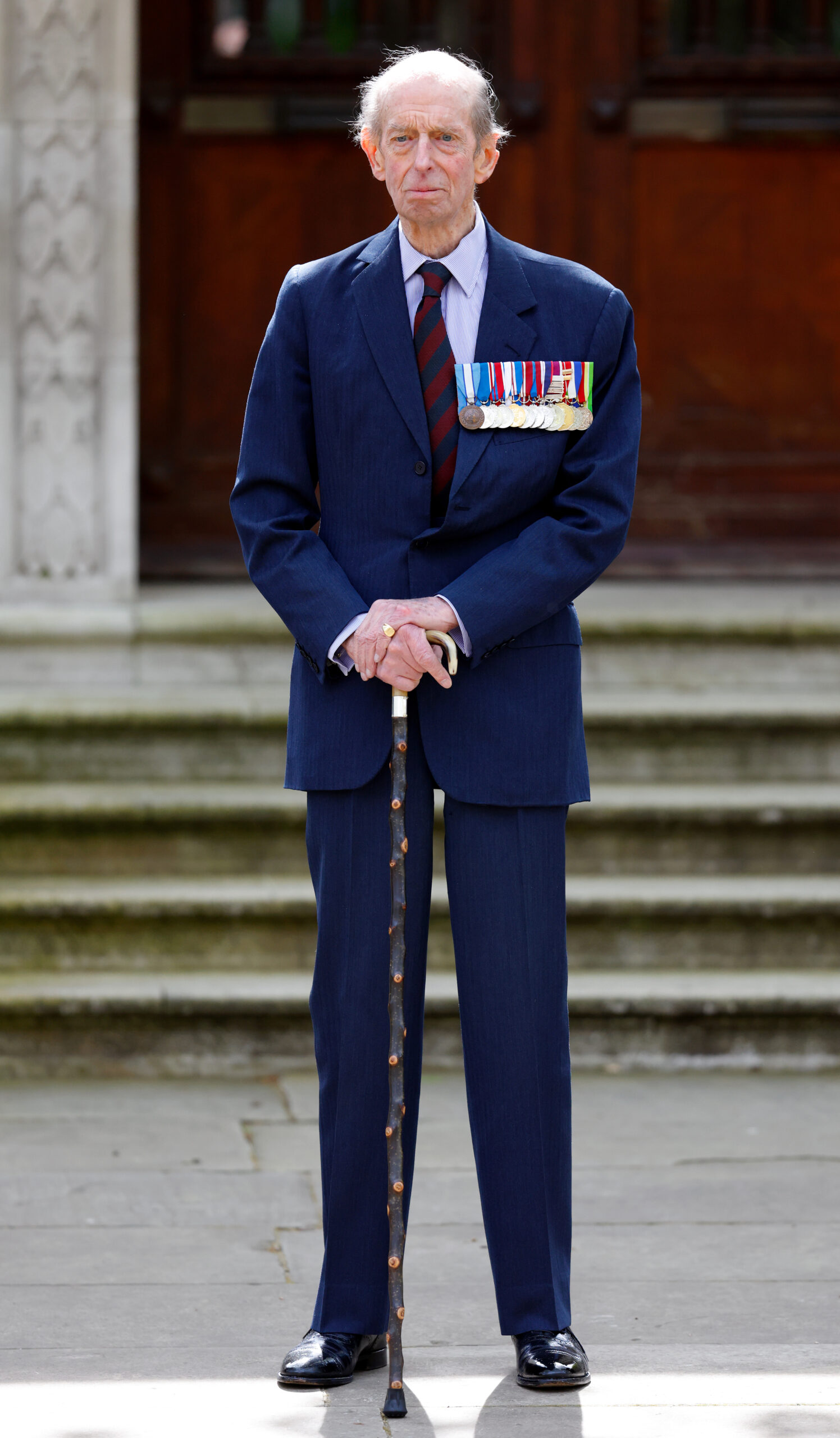 The Duke of Kent wearing a blue suit and military medals