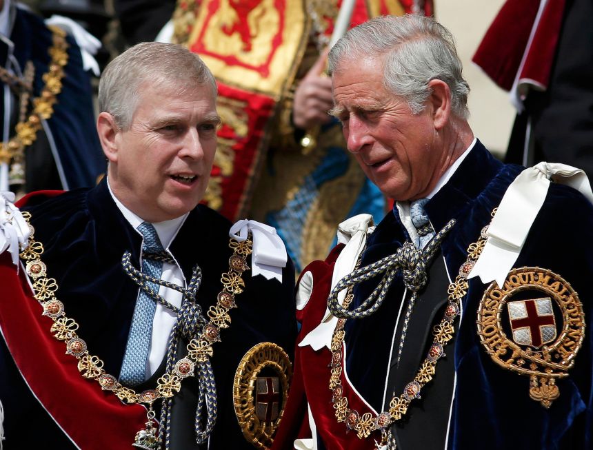 Andrew talks with his brother Charles at the Order of the Garter Service at St. George's Chapel in Windsor Castle in 2015. His membership in the Order is among the honors being removed by King Charles.