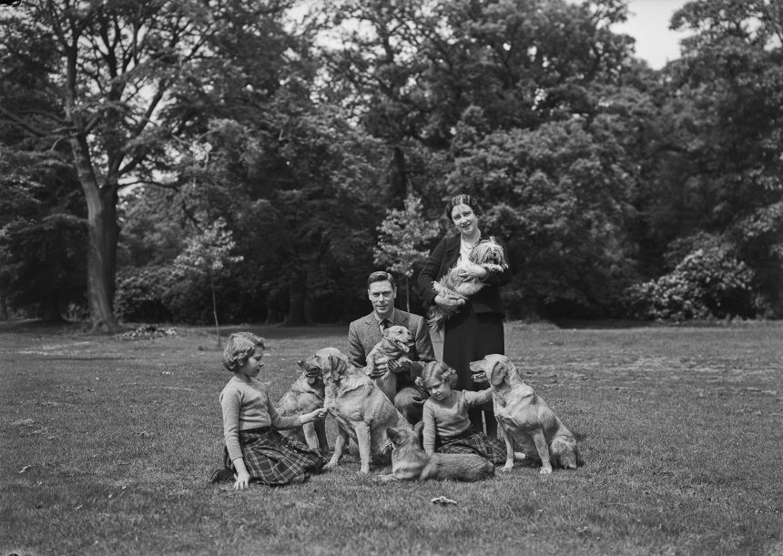 Princesses Margaret and Elizabeth pose with their parents, the Duke and Duchess of York, at the Royal Lodge, Windsor in June 1936.