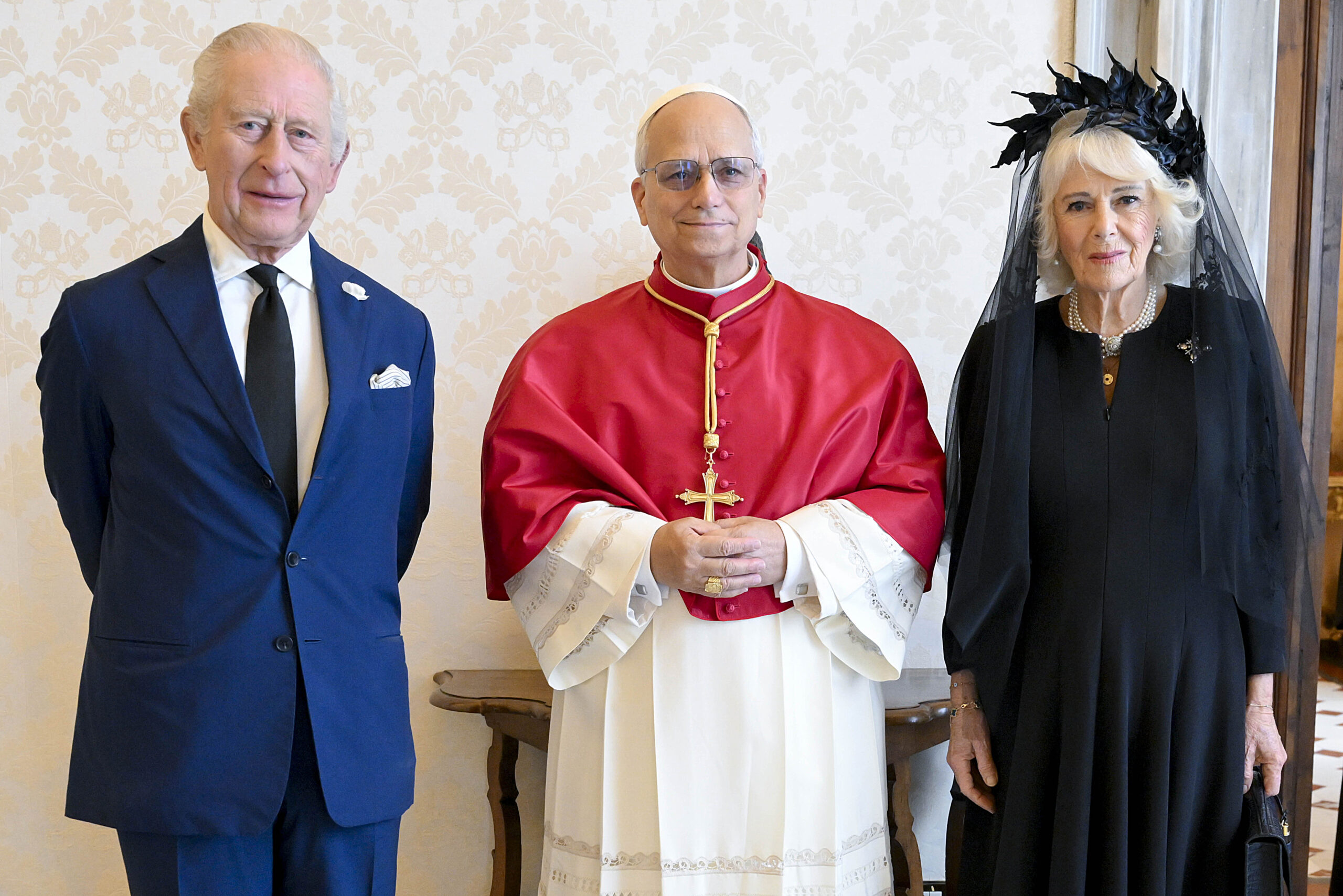 King Charles and Queen Camilla posing with Pope Leo