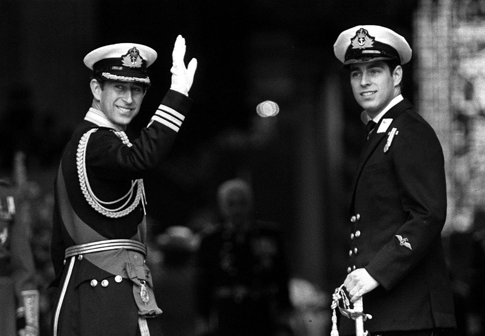 The Prince of Wales waves, accompanied by Prince Andrew, before entering St. Paul's Cathedral.