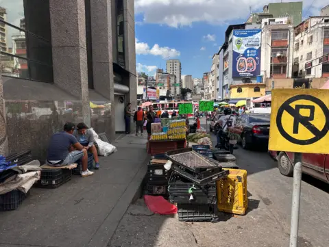 Informal vendor stalls on a street in Caracas