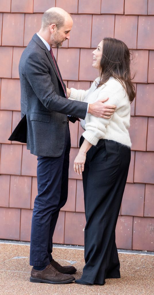 man and woman greeting each other
