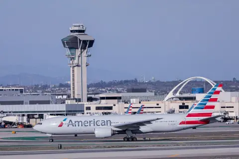 Anadolu via Getty Images An American Airlines flight on the tarmac at LAX airport.