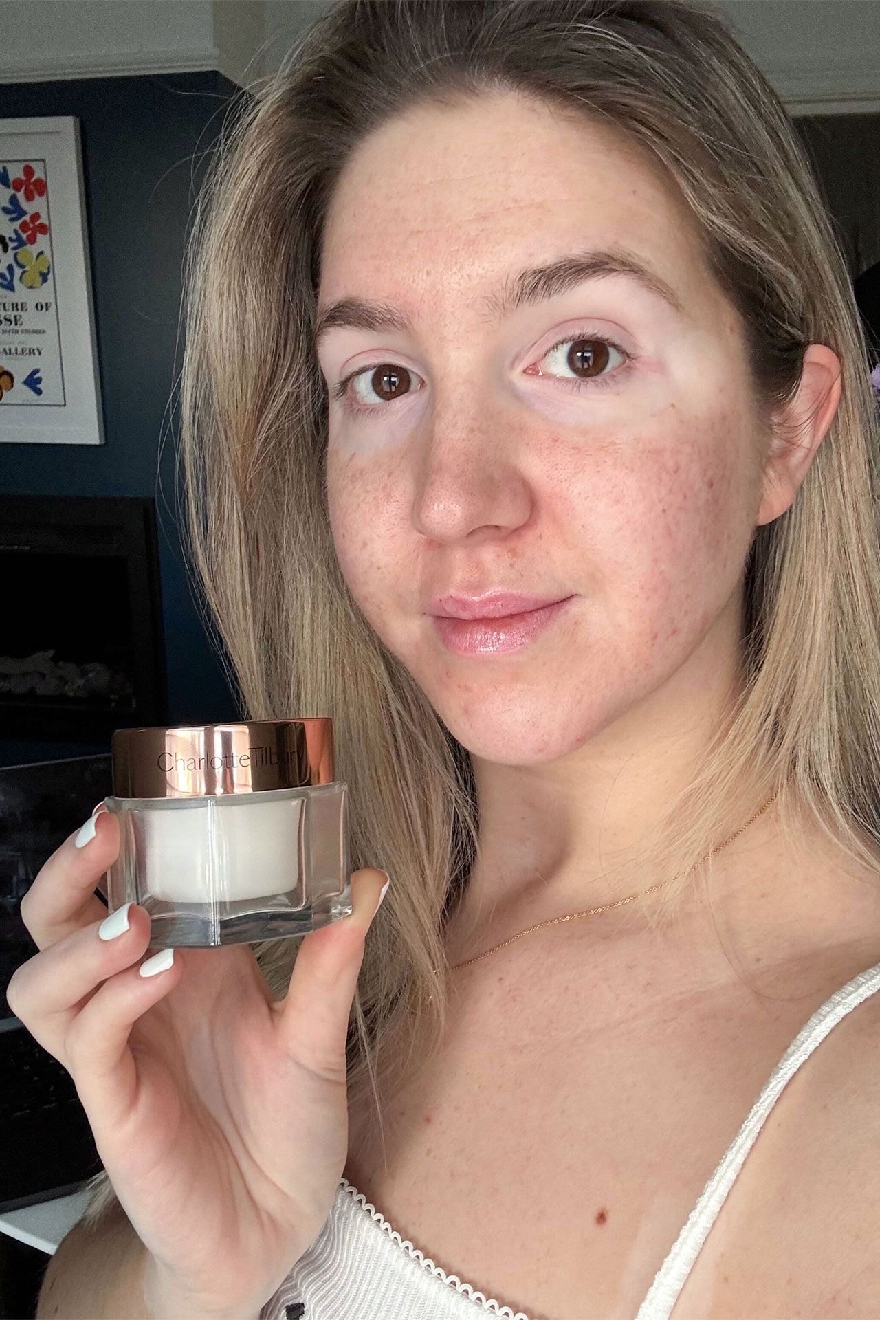 Image may contain Head Person Face Bottle Cosmetics Perfume Adult Accessories Jewelry Necklace and Photography