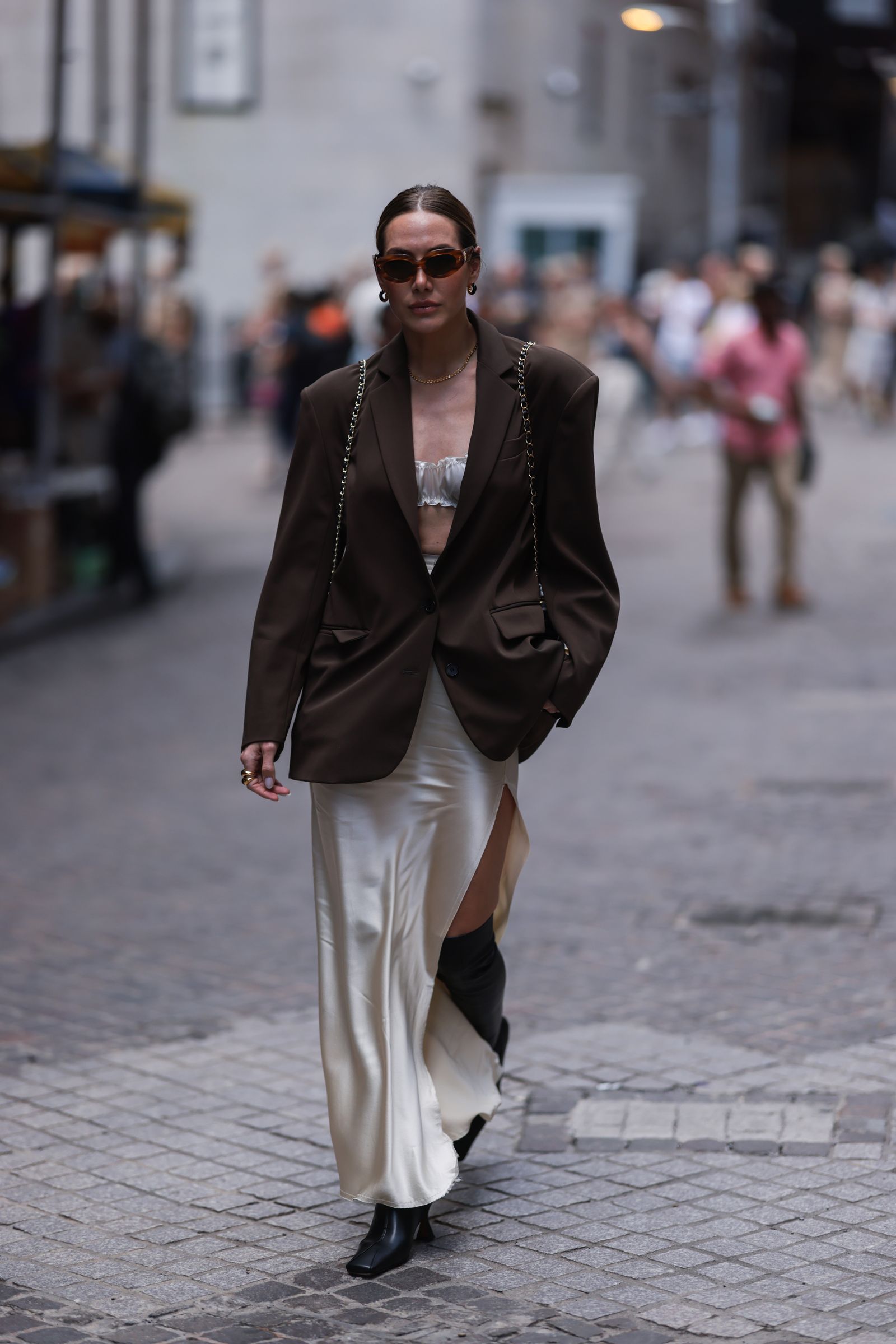 Image may contain Blazer Clothing Coat Jacket Pedestrian Person Accessories Glasses Formal Wear Suit and Adult