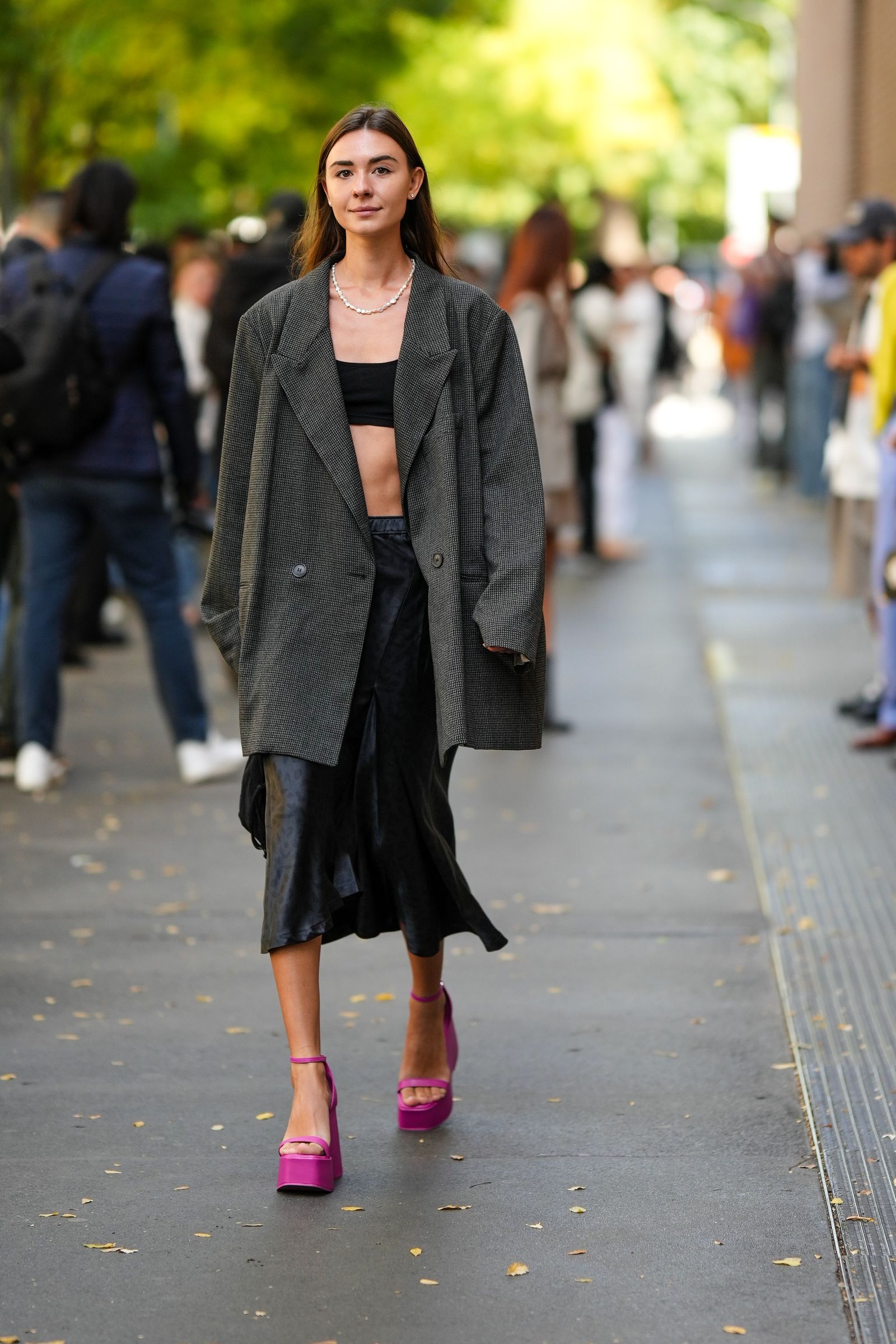 Image may contain Person Clothing Coat Footwear High Heel Shoe Backpack Bag Accessories Jewelry and Necklace