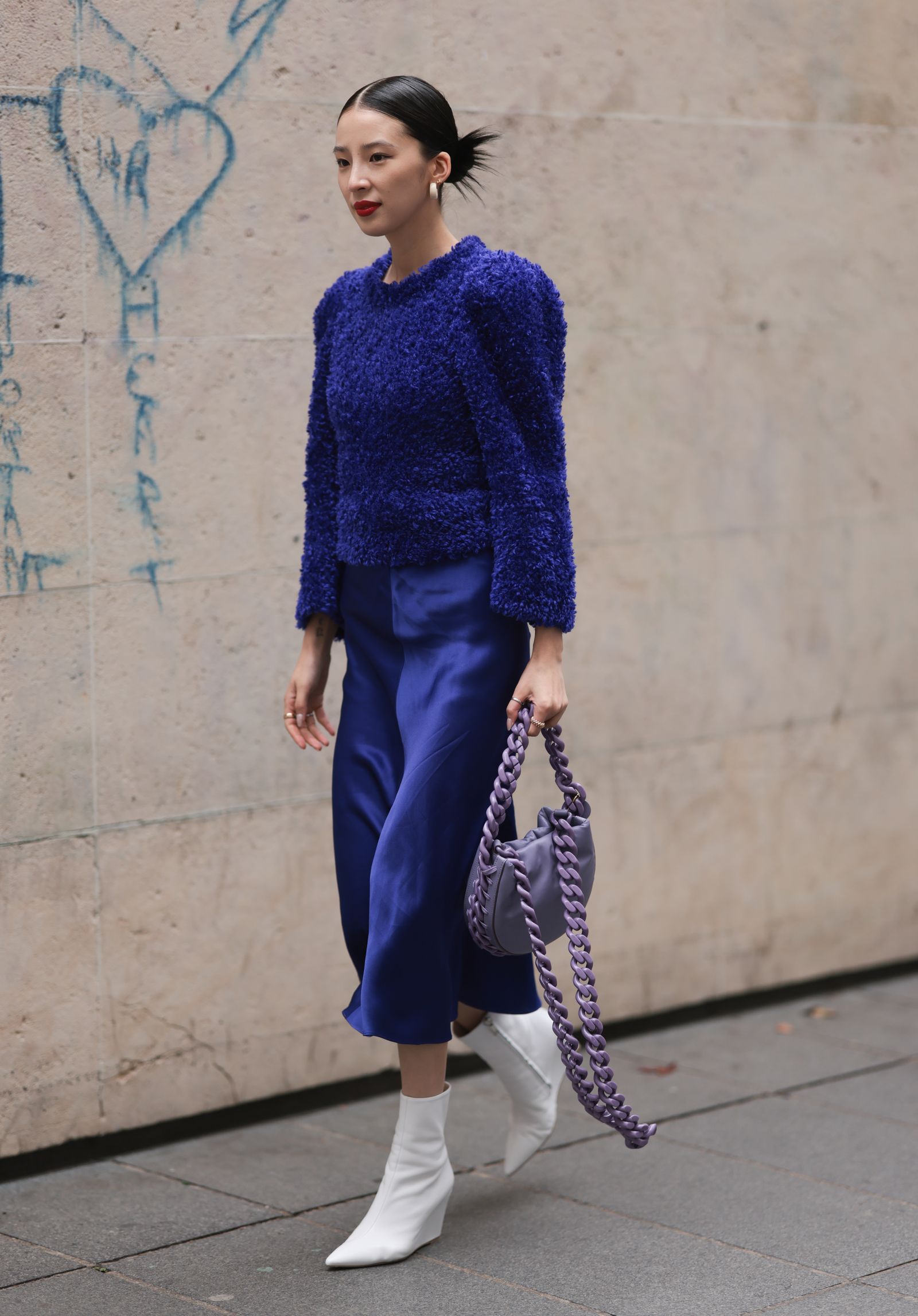 Image may contain Clothing Footwear Shoe High Heel Accessories Bag Handbag Person Pants Adult and Long Sleeve