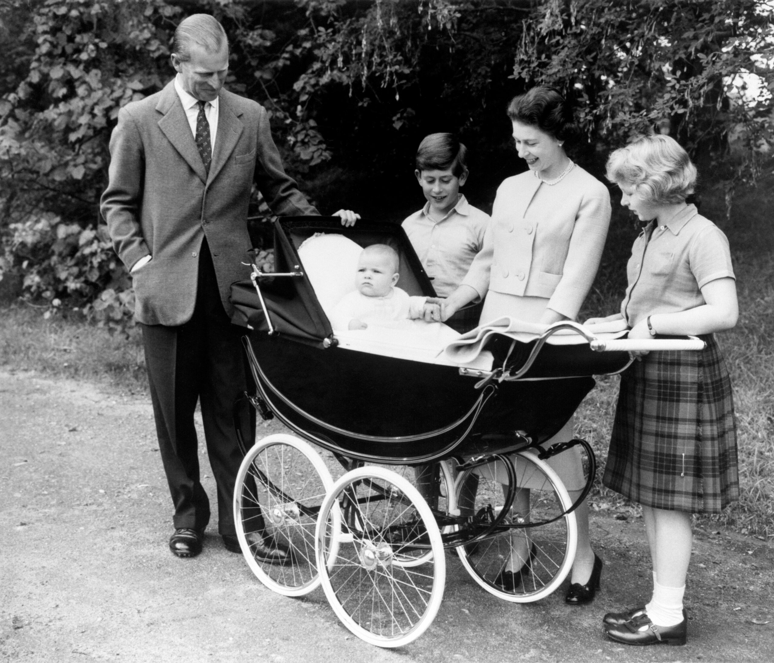 The pampered prince: Prince Andrew as a baby pictured in the comfort of his pram in the Balmoral Estate
