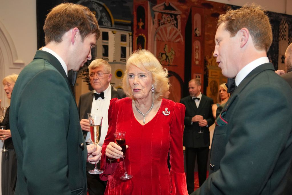 LONDON, ENGLAND - NOVEMBER 27: Queen Camilla, Colonel-in-Chief The Rifles and Royal Colonel 4th Battalion The Ranger Regiment, speaks to guests as she attends the Biennial RIFLES Awards Dinner on November 27, 2025 in London, England. (Photo by Kin Cheung - WPA Pool/Getty Images)