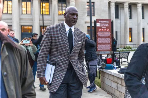 Getty Images Michael Jordan pictured outside of a federal courthouse in Charlotte, North Carolina on 1 December