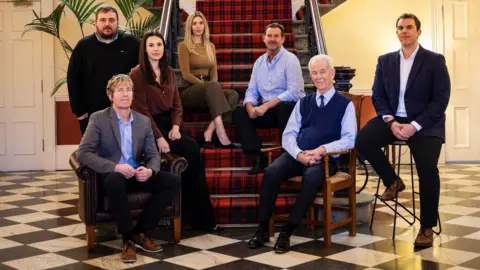 Walker's Shortbread The Walker family gathered at Walker's Shortbread head office. The late Sir Jim Walker is sitting front centre